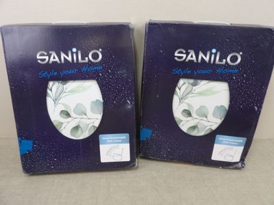 deux boîtes de savon Saniloo posées sur une table
