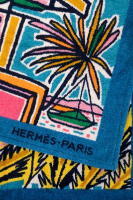 a towel that has a picture of a plant on it