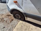 a white van that is parked on the side of the road