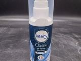 a close up of a bottle of toothpaste sitting on a counter