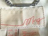 a close up of a white shirt with a chain on it