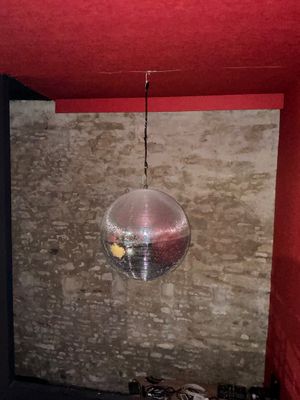 a disco ball hanging from the ceiling in a room