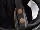 a close up of a helmet with a tag on it