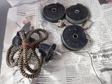 a couple of spools that are laying on a newspaper