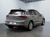 the rear end of a silver volkswagen suv parked in a garage