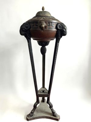 an image of a metal table with a bowl on top of it