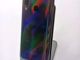 an image of a close up of a cell phone on a stand