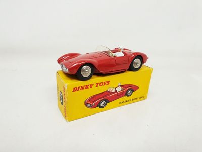 an image of a red toy car sitting on top of a yellow box