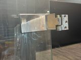 a glass door with a metal latch on it