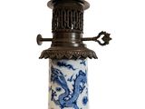 a blue and white lamp with a dragon on it
