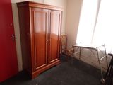 an image of a closet in a room with a red door