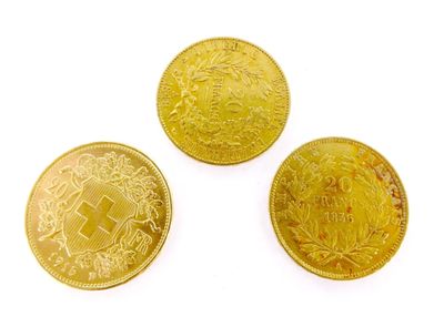 three different types of gold coins on a white background