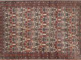 un ancien tapis persan à motif floral