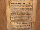 a label on the side of a wooden cabinet
