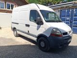 a white van parked in front of a blue container