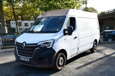 a white van that is parked on the side of the road