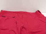 a close up of a pair of red pants on a white surface