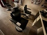 an image of a salon room with a chair and a counter