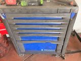 a tool box with tools on top of it on a table