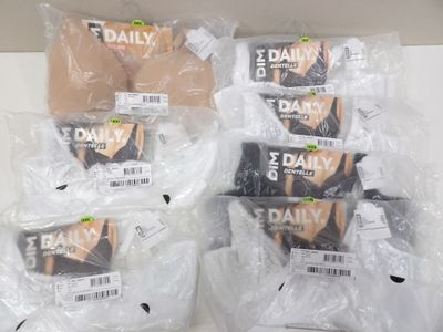 several packages of underwear are wrapped in plastic bags on a counter