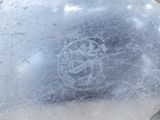 a close up of a metal object with a logo on it
