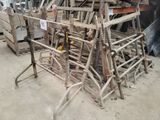 a pile of chairs that are sitting in a warehouse
