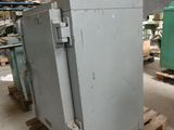 a large metal box sitting on a pallet in a warehouse