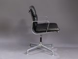 an image of a black leather office chair with a chrome steel frame