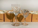 two wine glasses sitting next to each other on a table