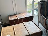 two suitcases and a chair in a room with a window