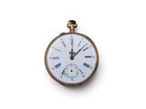 a gold pocket watch with roman numerals on the face