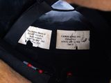 a close up of a fireman ' s hat with labels on it