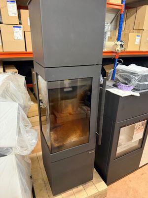 two stoves that are sitting in the middle of a room