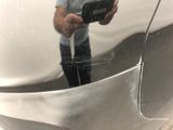 a man that is taking a picture of himself in the mirror