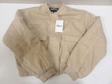 the jacket is tan and has a tag on it
