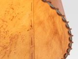 a close up of a lamp with a brown shade on it