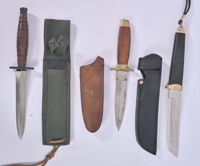 several different types of knives are lined up on a white surface