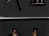four figurines of soldiers in a black box