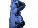 a blue teddy bear that is sitting on a white surface