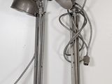 two lamps that are sitting on the wall