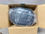 a cardboard box with a plastic bag inside of it
