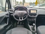 the interior of a small car with a steering wheel and dashboard