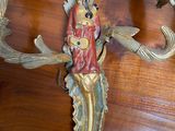 a wooden table with a clock on it that has a bird on it