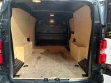 the back of a van with the door open and the back of the van in the back of the van