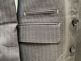 a close up of a man ' s suit jacket and tie
