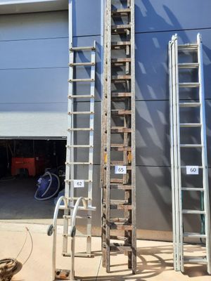 three ladders that are standing next to each other