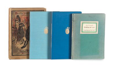 three books sitting on top of each other on a white surface