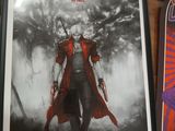 two framed posters of devil may cry and a skateboard on a table