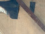 an old axe and a wooden handle on a piece of cloth