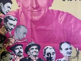 a poster with a picture of a man in a car